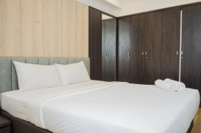 Comfy 1BR Apartment with Motorized Standing Desk at Branz BSD City By Travelio